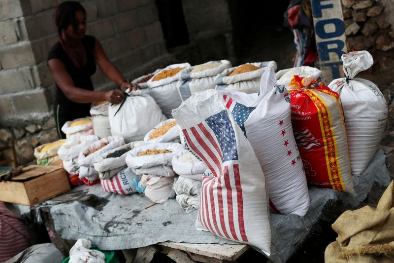 &copy; Reuters. FILE PHOTO: A local sells rice and grains at a street market in Port-au-Prince, Haiti, February 19, 2019. REUTERS/Ivan Alvarado/File Photo