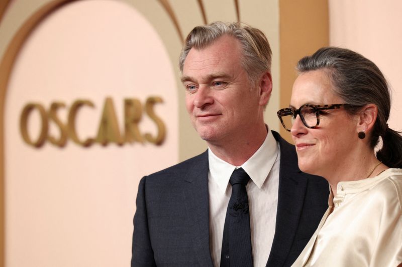 &copy; Reuters. FILE PHOTO: Christopher Nolan, nominated for Best Director for "Oppenheimer" which is also nominated for Best Adapted Screenplay and Best Picture, and his wife Emma Thomas, producer of "Oppenheimer", attend the Nominees Luncheon for the 96th Oscars in Bev