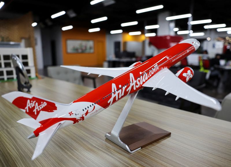 &copy; Reuters. A replica of AirAsia plane is seen at the airline's parent company, Capital A's office in Sepang, Malaysia, February 26, 2024. REUTERS/Hasnoor Hussain