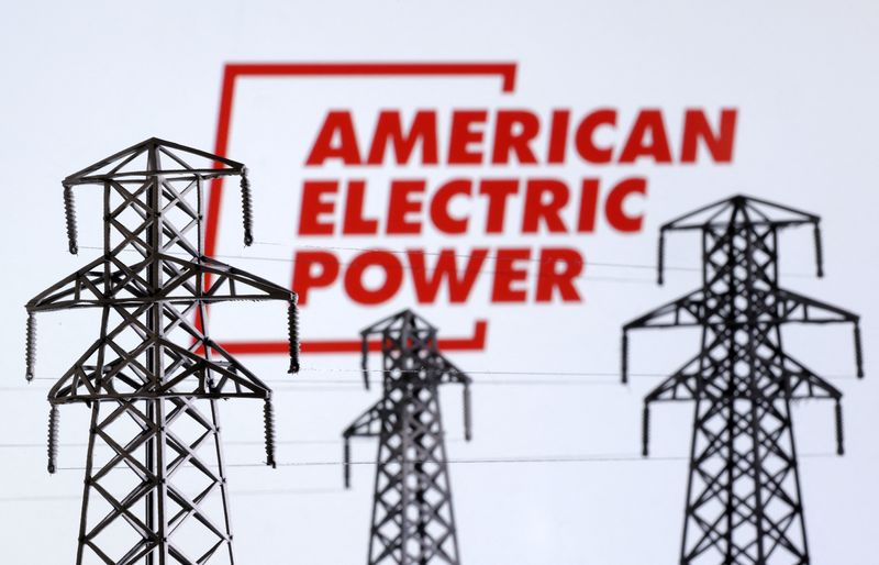&copy; Reuters. Electric power transmission pylon miniatures and American Electric Power logo are seen in this illustration taken, December 9, 2022. REUTERS/Dado Ruvic/Illustration
