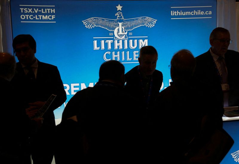 &copy; Reuters. FILE PHOTO: Visitors speak with representatives at the Lithium Chile mining exploration company booth during the Prospectors and Developers Association of Canada (PDAC) annual convention in Toronto, Ontario, Canada March 4, 2019. REUTERS/Chris Helgren/Fil