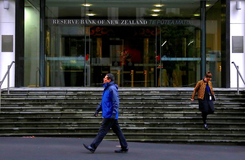 &copy; Reuters. Pedestrians walk near the main entrance to the Reserve Bank of New Zealand located in central Wellington, New Zealand, July 3, 2017. Picture taken July 3, 2017.   REUTERS/David Gray/file photo