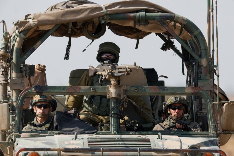&copy; Reuters. Soldiers sit in a military vehicle near the Israel-Gaza border, amid the ongoing conflict between Israel and the Palestinian Islamist group Hamas, in Israel, February 28, 2024. REUTERS/Amir Cohen