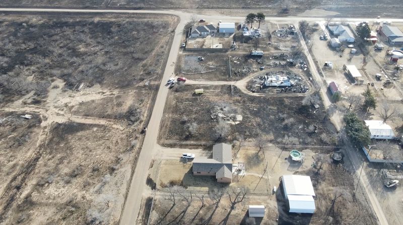© Reuters. A drone view of buildings damaged by a wildfire in Stinnett, Texas, U.S., February 28, 2024, in this screengrab obtained from a social media video. Tucker Stroud/via REUTERS  