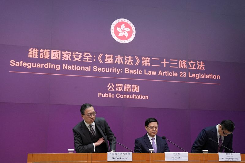 &copy; Reuters. FILE PHOTO: Hong Kong's Secretary for Justice Paul Lam, Chief Executive John Lee and Secretary for Security Chris Tang Ping-keung attend a press conference regarding the legislation of Article 23 national security laws, in Hong Kong, China January 30, 202