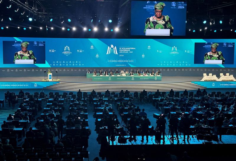 © Reuters. FILE PHOTO: Director-General of the World Trade Organization Ngozi Okonjo-Iweala speaks during the opening ceremony of the WTO ministerial meeting in Abu Dhabi, United Arab Emirates, February 26, 2024. REUTERS/Abdel Hadi Ramahi/File Photo