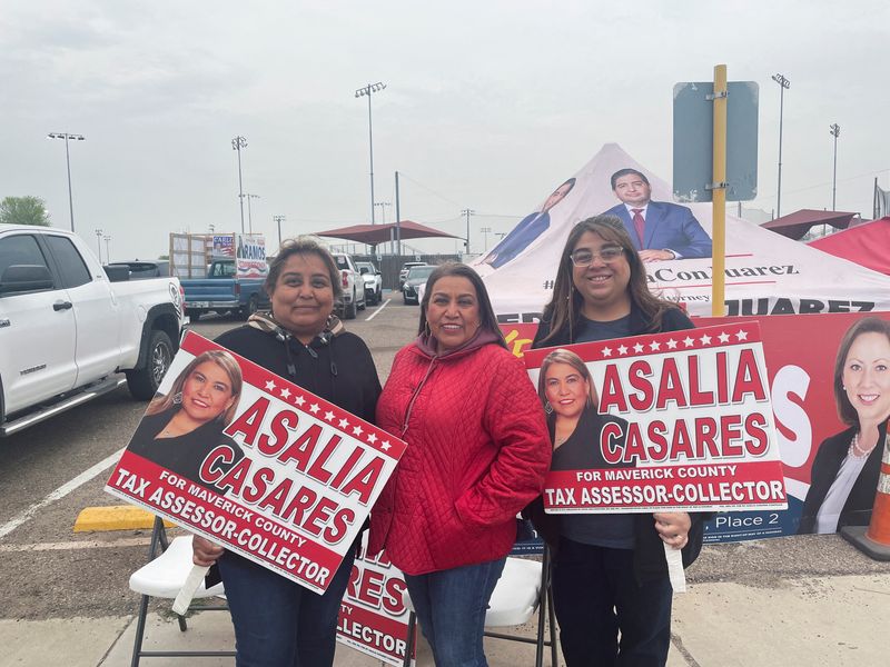 &copy; Reuters. Asalia Casares, a Maverick County tax official, poses for a photo with Alejandra Casares and Sonia Campos near an early voting site in Eagle Pass, Texas, U.S., February 28, 2024. REUTERS/Ted Hesson