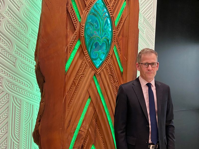 &copy; Reuters. FILE PHOTO: Assistant Governor Christian Hawkesby stands with an art installation of Maori forest god Tane Mahuta at the lobby of New Zealand's Central Bank building in Wellington, New Zealand September 22, 2021. REUTERS/Praveen Menon/File Photo