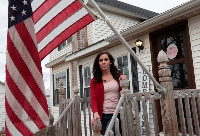 &copy; Reuters. Michigan Republican Bree Moeggenberg poses next to an American flag in front of her home in Mount Pleasant, Michigan, U.S. February 14, 2024. REUTERS/Rebecca Cook