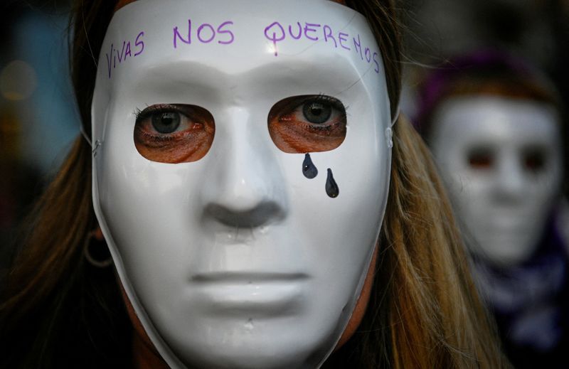 &copy; Reuters. FILE PHOTO: A woman of the movement "Not one (woman) less" wears a mask during a march to the Congress to protest against femicides and gender violence, in Buenos Aires, Argentina June 3, 2022. The mask reads: "We want us alive." REUTERS/Mariana Nedelcu/F
