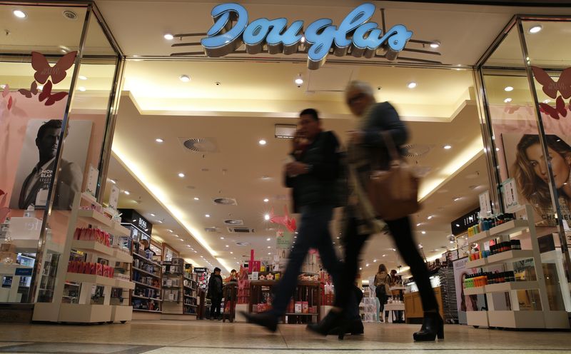 &copy; Reuters. FILE PHOTO: People pass in front of Douglas Holding AG perfume shop at a shopping mall in Magdeburg, Germany, March 11, 2016. REUTERS/Fabrizio Bensch/File Photo