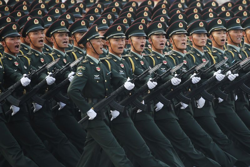 &copy; Reuters. FILE PHOTO: Soldiers of People's Liberation Army (PLA) march in formation past Tiananmen Square during a rehearsal before a military parade marking the 70th founding anniversary of People's Republic of China, on its National Day in Beijing, China October 