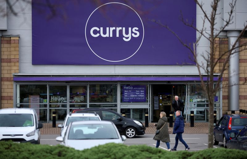&copy; Reuters. FILE PHOTO: People walk past a Currys electrical store in Altrincham, Britain, February 19, 2024. REUTERS/Phil Noble/File Photo