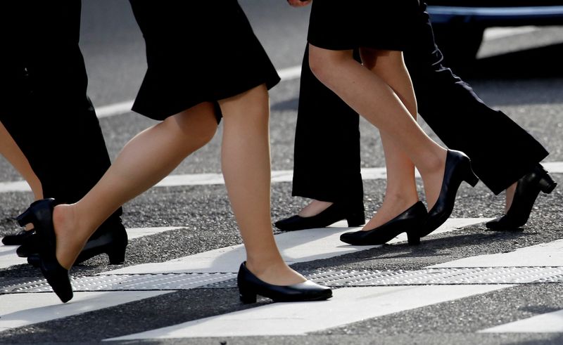 &copy; Reuters. Women in high heels walk at a business district in Tokyo, Japan, June 4, 2019.  REUTERS/Kim Kyung-Hoon/file photo