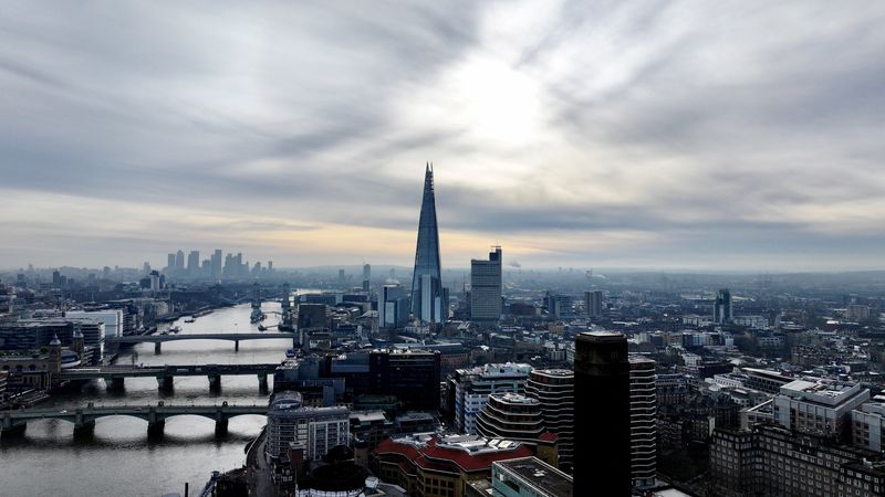 &copy; Reuters. FILE PHOTO: A drone view of London's Shard skyscraper with the Canary Wharf financial district in the background, two days before the government presents its critical pre-election budget, in London, Britain March 3, 2024. REUTERS/Yann Tessier/File Photo