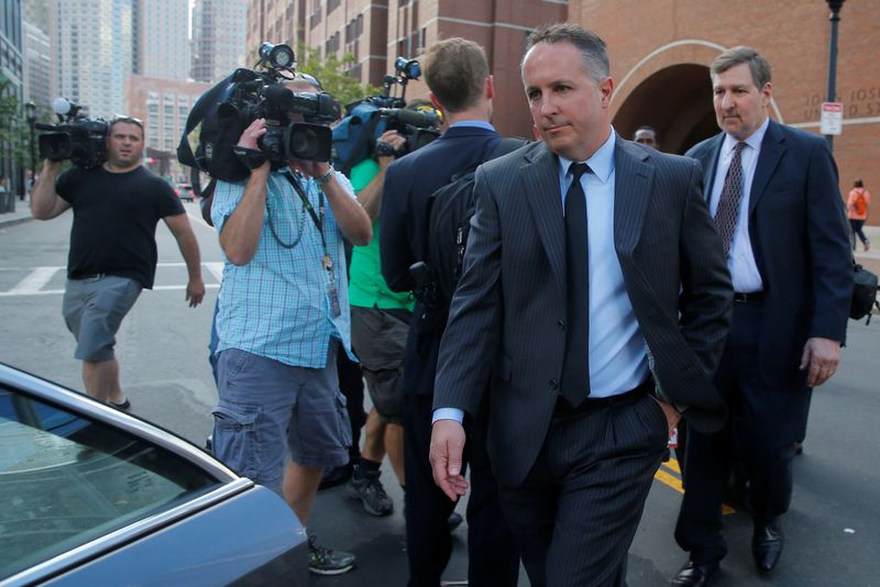 &copy; Reuters. FILE PHOTO: Pharmacist and co-founder of the now-defunct New England Compounding Center Barry Cadden walks to his car after being sentenced to nine years in jail, beginning in August, for his role in a deadly U.S. meningitis outbreak in 2012, in Boston, M