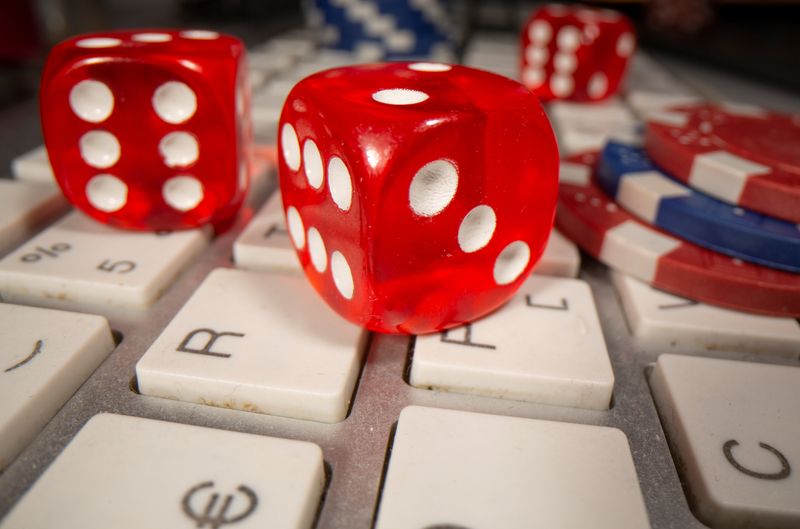 &copy; Reuters. Gambling dice and chips are seen on the keyboard in this illustration picture, June 5, 2020. REUTERS/Dado Ruvic/Illustration/file photo