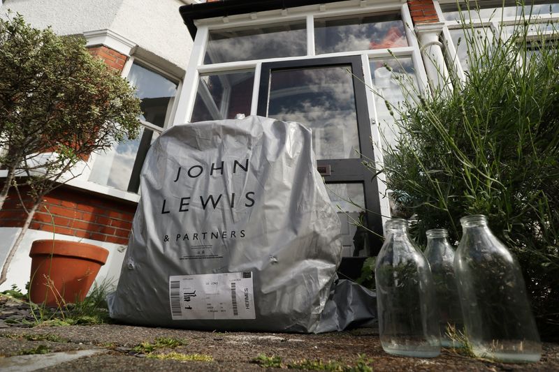 &copy; Reuters. An online delivery package from British retailer John Lewis Partnership is seen on the doorstep of a home in London, Britain, in this illustration picture taken June 15, 2020. REUTERS/Russell Boyce/Illustration/File Photo