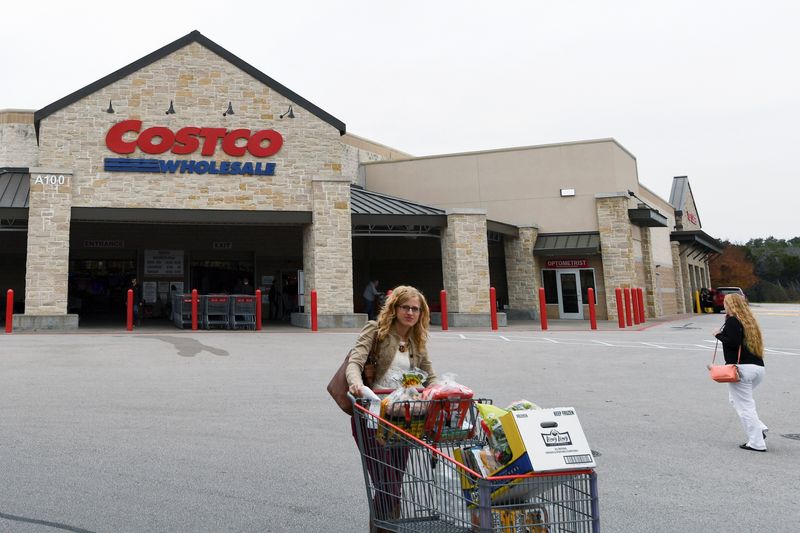 &copy; Reuters. FILE PHOTO: A woman exits a Costco Wholesale retail club in Austin, Texas, U.S. December 14, 2016. REUTERS/Mohammad Khursheed/File Photo
