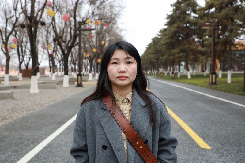 &copy; Reuters. 　中国では夫や子どものいない未来を思い描く女性が増えており、政府にとって避けがたい課題となっている。写真はコピーライターのチャイ・ワンロウさん（２８）。陝西省西安市で１日