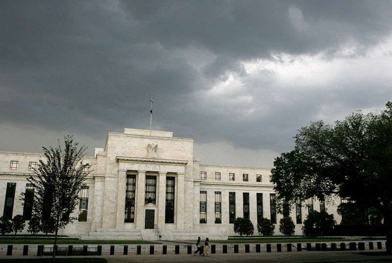 &copy; Reuters. FILE PHOTO: Early summer storm clouds gather over the U.S. Federal Reserve Building before an evening thunderstorm in Washington June 9, 2006. REUTERS/Jim Bourg/File Photo