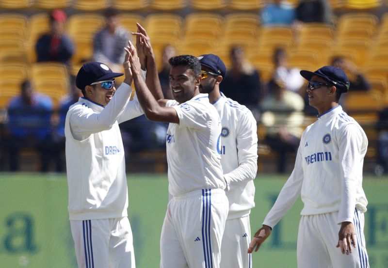 &copy; Reuters. Cricket - Fifth Test - India v England - Himachal Pradesh Cricket Association Stadium, Dharamshala, India - March 9, 2024 India's Ravichandran Ashwin celebrates with teammates after taking the wicket of England's Ben Stokes REUTERS/Adnan Abidi