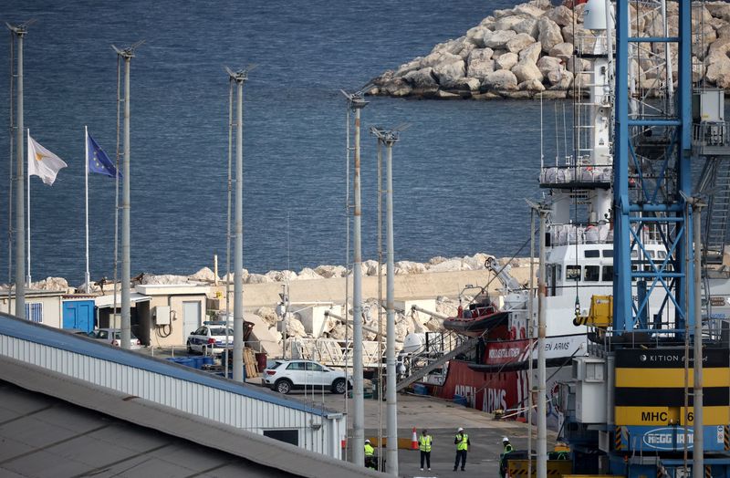 &copy; Reuters. Workers stand near a rescue vessel of the Spanish NGO Open Arms at the port of Larnaca, Cyprus March 9, 2024. REUTERS/Yiannis Kourtoglou