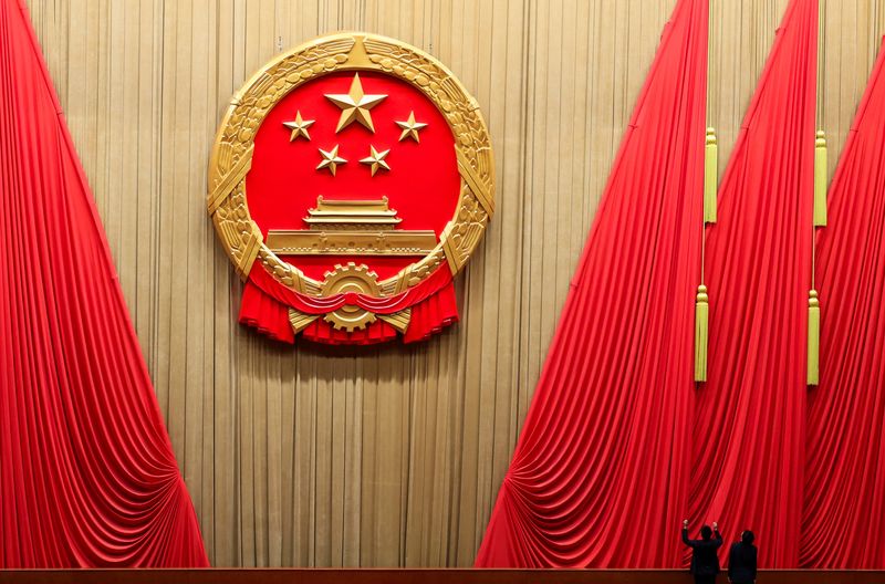 &copy; Reuters. Staff members work inside the Great Hall of the People ahead of the closing session of the National People's Congress (NPC), in Beijing, China March 11, 2024. REUTERS/Tingshu Wang