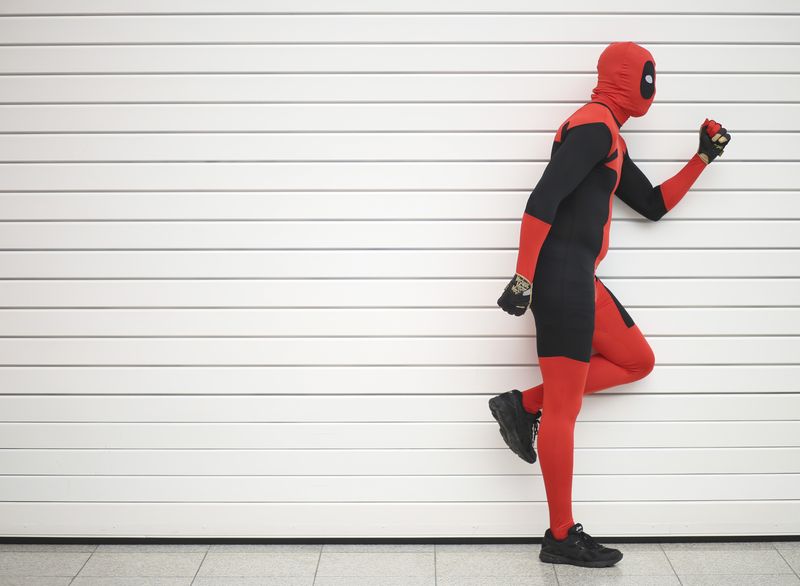 © Reuters. FILE PHOTO: Ricky Santiago dressed as Deadpool from the Marvel comic book poses for a photograph at the London supercomic convention at the Excel centre, east London, March 14 , 2015. REUTERS/Paul Hackett  