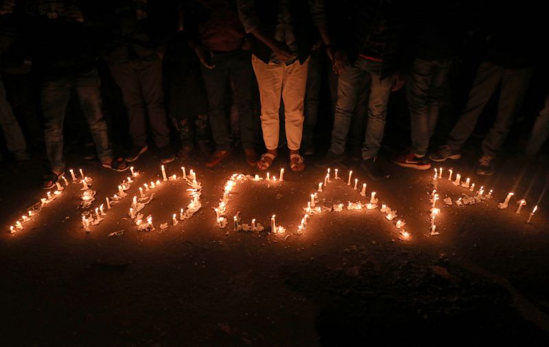 &copy; Reuters. Candles spell out "No CAA" during a protest against the Citizenship Amendment Act, a new citizenship law, in New Delhi, India, December 29, 2019. REUTERS/Anushree Fadnavis/File Photo