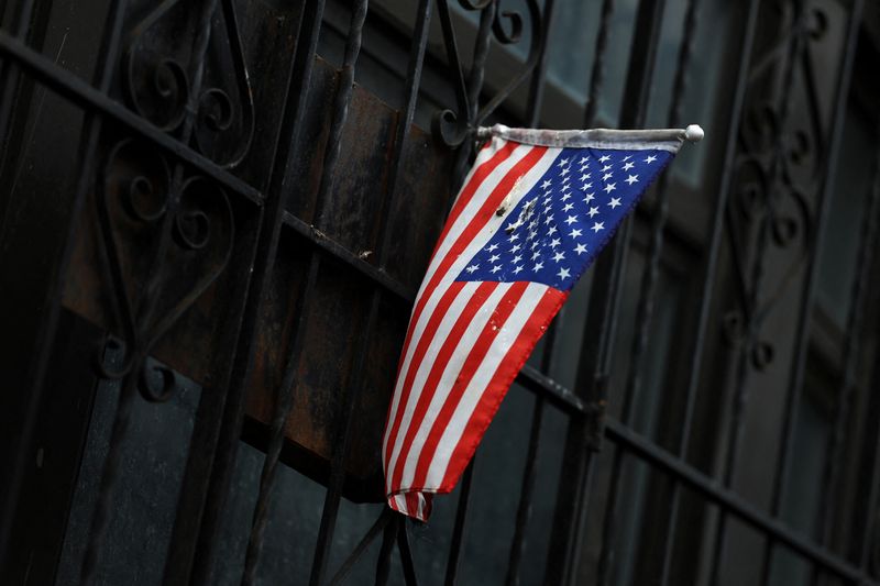 &copy; Reuters. A U.S. flag hangs out the gated entrance to an apartment in the Washington Heights neighborhood of the borough of Manhattan in New York City, U.S., March 7, 2024. REUTERS/Shannon Stapleton/ File Photo