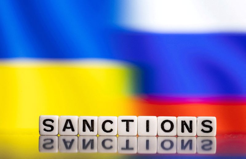 &copy; Reuters. FILE PHOTO: Plastic letters arranged to read "Sanctions" are placed in front of Ukraine's and Russia's flag colors  in this illustration taken February 25, 2022. REUTERS/Dado Ruvic/Illustration/File Photo