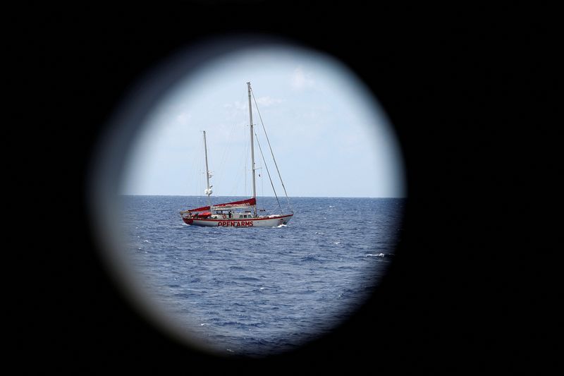 &copy; Reuters. FILE PHOTO: NGO Proactiva Open Arms rescue boat Astral is seen through a porthole in central Mediterranean Sea, August 22, 2022. REUTERS/Juan Medina/File Photo