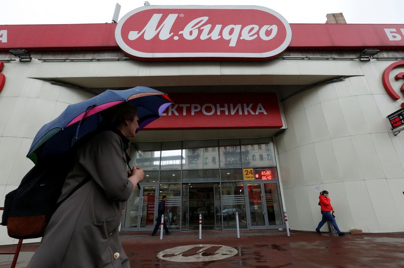 &copy; Reuters. FILE PHOTO: A woman walks in front of a store of Russia's biggest electrical and white goods retailer M.video in Moscow, Russia April 15, 2016. REUTERS/Maxim Zmeyev/File photo
