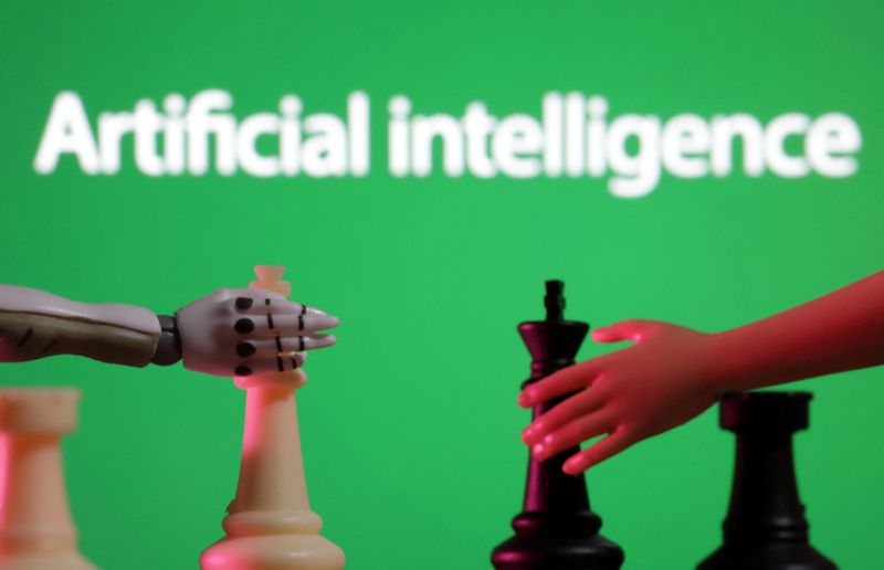&copy; Reuters. Words reading "Artificial intelligence", miniature of robot and toy hand are pictured in this illustration taken December 14, 2023. REUTERS/Dado Ruvic/Illustration/File Photo