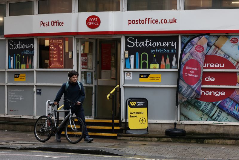 &copy; Reuters. A cyclist walks past a Post Office branch in Westminster, London, Britain, March 12, 2024. REUTERS/Hollie Adams