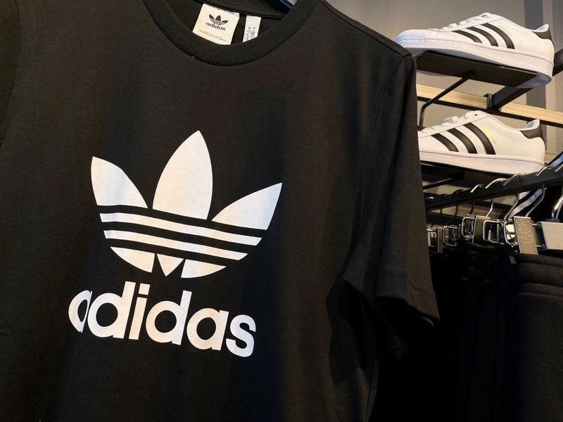 Adidas posts first loss in 30 years and warns on US
