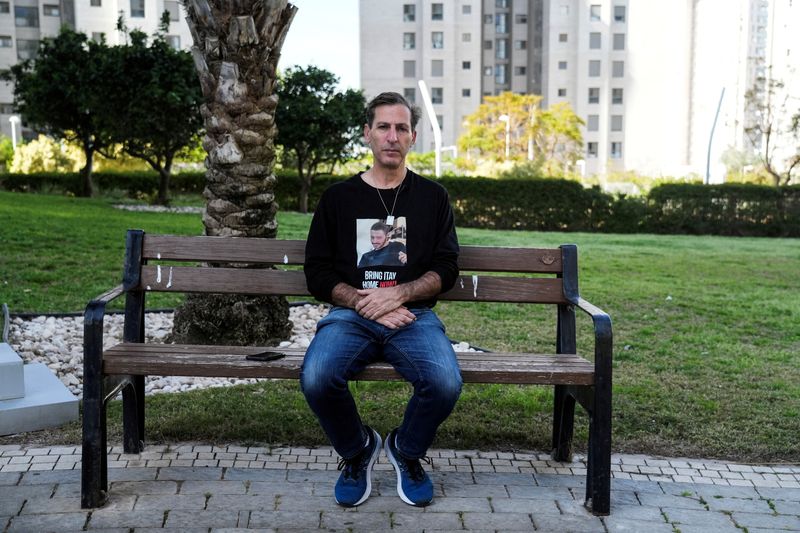 &copy; Reuters. Ruby Chen, father of deceased U.S.-Israeli hostage Itay Chen, whose body is held by the Palestinian Islamist group Hamas in the Gaza Strip, sits on a park bench during an interview with Reuters in Netanya, Israel, March 13, 2024. REUTERS/Janis Laizans