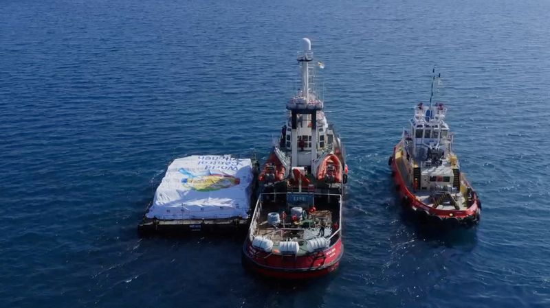 &copy; Reuters. Aid ship sails, amidst a test to launch a new sea route from a port in Cyprus to deliver aid to residents of the Gaza Strip who are on the brink of famine, at sea, March 12, 2024, in this screen grab from a handout video.  World Central Kitchen/Handout vi