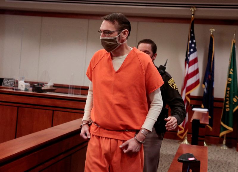 &copy; Reuters. FILE PHOTO: James Crumbley, parent of accused Oxford High School gunman Ethan Crumbley, is escorted into the courtroom by a Oakland Count Sheriff during a court procedural hearing in Rochester Hills, Michigan, U.S., February 24, 2022. REUTERS/Rebecca Cook