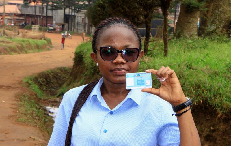 &copy; Reuters. Stephanie Mbafumoja, a Congolese law student holds her voter identity card in L'avenue de L'itav in Butembo, North Kivu province, Democratic Republic of Congo, February 9, 2024. REUTERS/Yassin Kombi