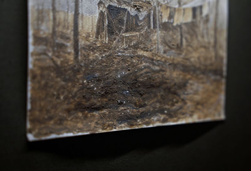 &copy; Reuters. Trench mud is visible on a fragment of a painting displayed at the exhibition of a Ukrainian serviceman Oleg Bazylewicz, 59, who draws pictures with mud, clay and ashes from a frontline, amid Russia's attack on Ukraine, in Kyiv, Ukraine March 11, 2024. RE