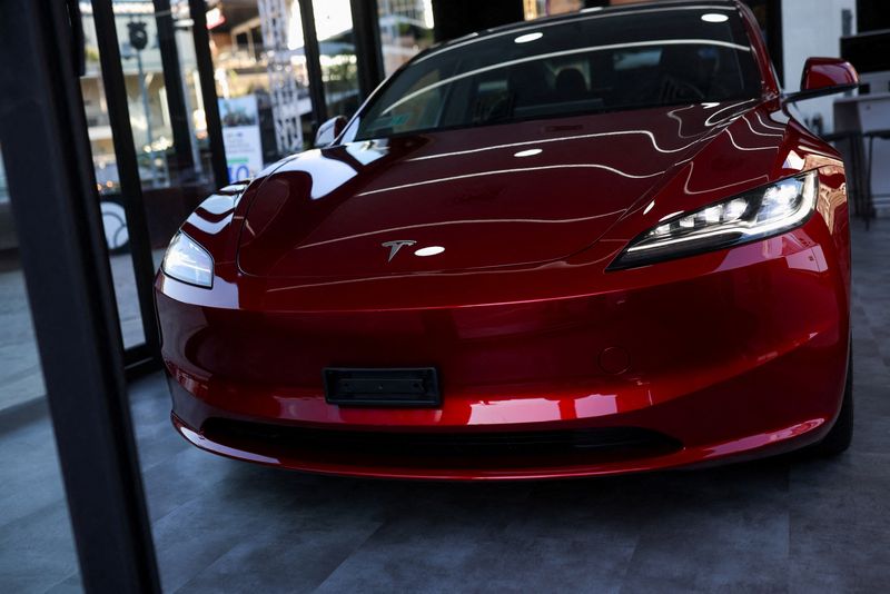 &copy; Reuters. FILE PHOTO: A car is displayed during the inauguration of the first Tesla store in Santiago, Chile, February 1, 2024. REUTERS/Pablo Sanhueza/File Photo