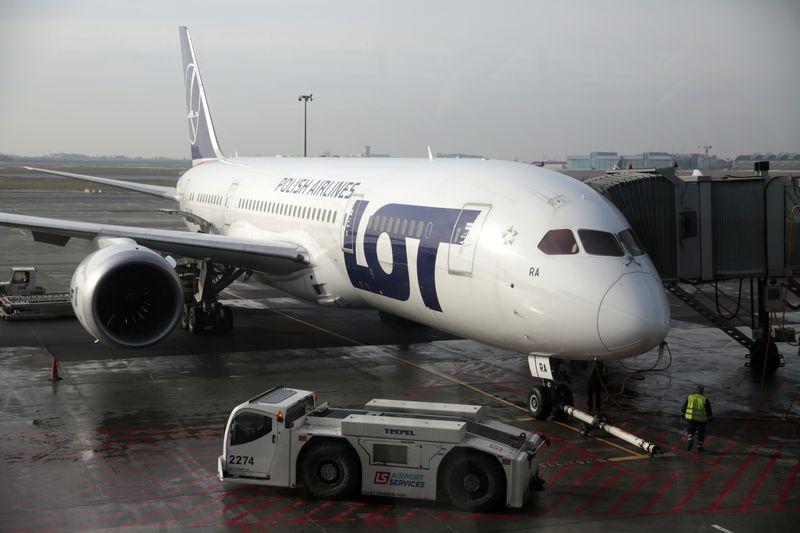 &copy; Reuters. Polish Airlines LOT aircraft  Boeing 787 Dreamliner jet is pictured through the window at Chopin airport in Warsaw February 9, 2014. REUTERS/Kacper Pempel/File Photo
