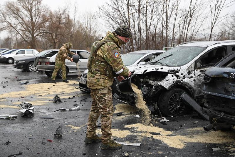 &copy; Reuters. Military personnel are seen in the aftermath of what local authorities called a Ukrainian missile attack, in the course of the Russia-Ukraine conflict in Belgorod, Russia, March 17, 2024. Governor of Belgorod Region/Vyacheslav Gladkov via Telegram/Handout