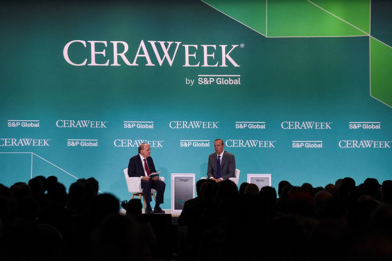 &copy; Reuters. FILE PHOTO: Mike Wirth, the CEO of Chevron Corporation, speaks with Daniel Yergin, the vice chairman of S&P Global, as top energy executives and officials from around the world gather during the CERAWeek 2023 by S&P Global, energy conference in Houston, T
