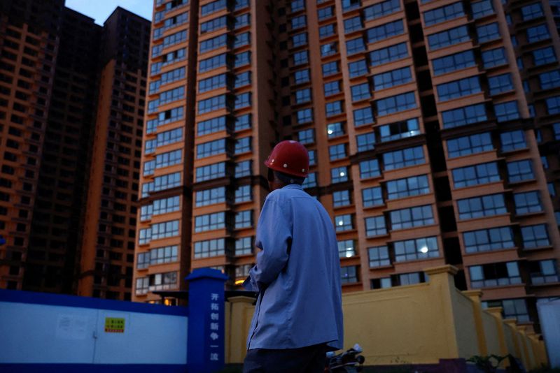&copy; Reuters. FILE PHOTO: Zhao Youming, 60, looks at an unfinished residential building where he bought an apartment, at the Gaotie Wellness City complex in Tongchuan, Shaanxi province, China September 12, 2023. REUTERS/Tingshu Wang/File Photo