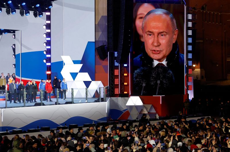 &copy; Reuters. Russian incumbent President Vladimir Putin, who was declared winner of the presidential election by the country's electoral commission, delivers a speech during a rally, which marks the 10th anniversary of Russia's annexation of Crimea from Ukraine, in Re