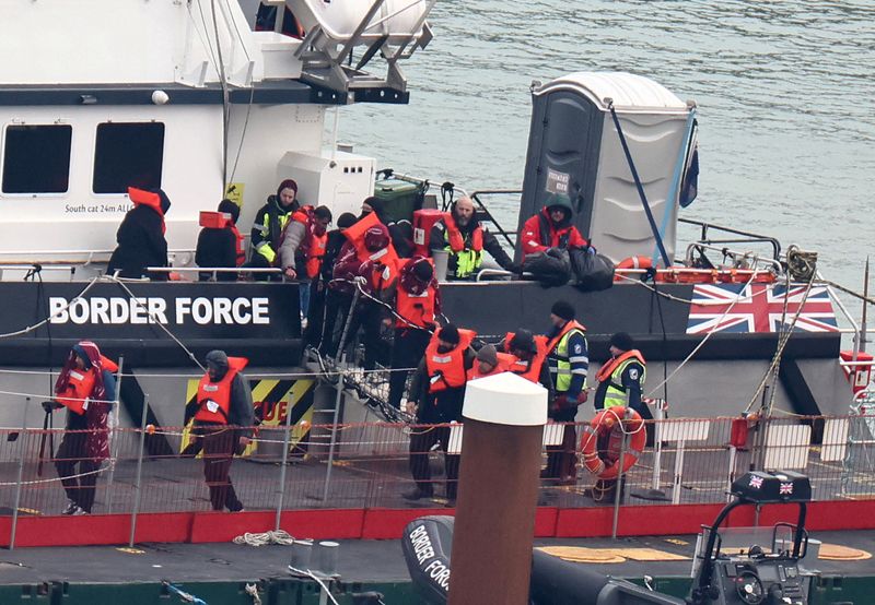&copy; Reuters. FILE PHOTO: People, believed to be migrants, disembark from a British Border Force vessel as they arrive at Port of Dover, Dover, Britain, January 17, 2024. REUTERS/Toby Melville/File Photo