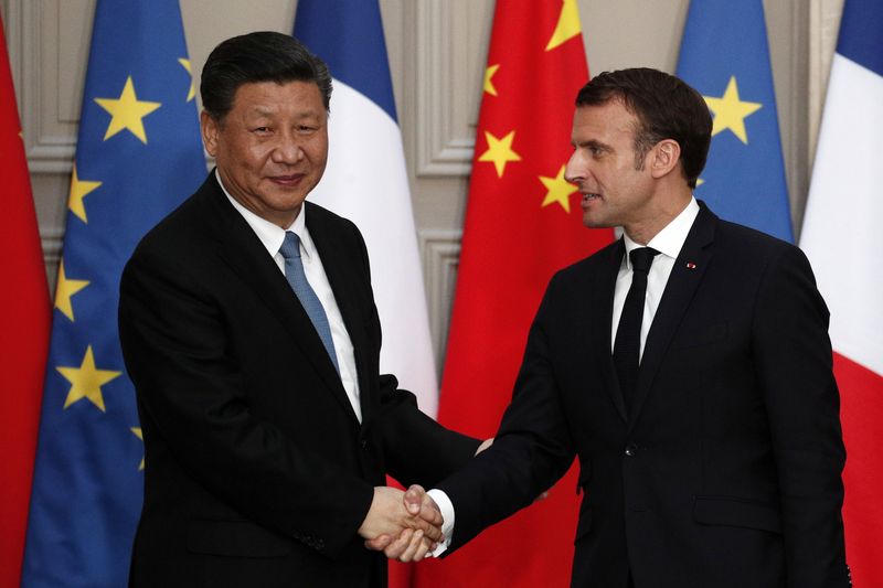 &copy; Reuters. Photo d'archives de Xi Jinping et d'Emmanuel Macron à Paris. /Photo prise le 25 mars 2019 à Paris, France/REUTERS/Yoan Valat